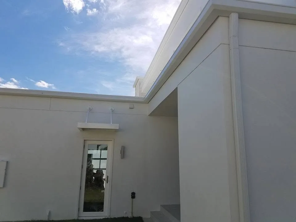 Glass side door cable canopy white stucco flat roof downspout, Lake Mary